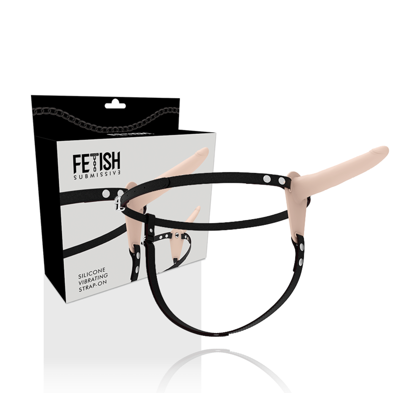 FETISH SUBMISSIVE HARNESS: arnés strap-on negro con accesorio tono piel y caja del producto.