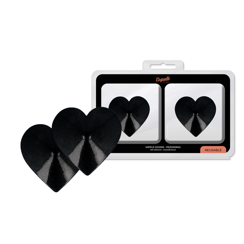 Coquette Chic Desire: cubiertas metálicas negras para pezones en forma de corazón, con la caja del producto detrás.