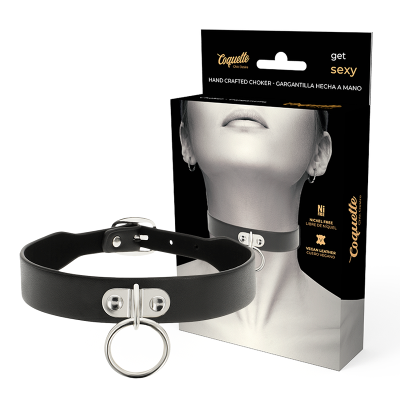 Collar choker negro Coquette Accessories con aro metálico y caja del producto.