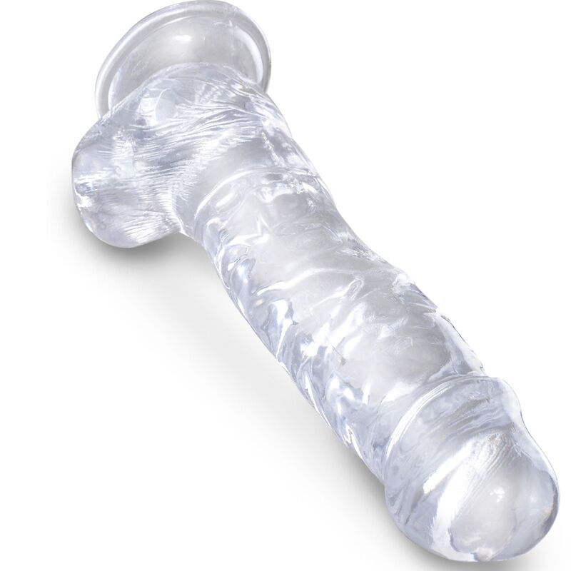 King Cock Clear en detalle, dildo transparente realista con base ensanchada y testículos visibles.