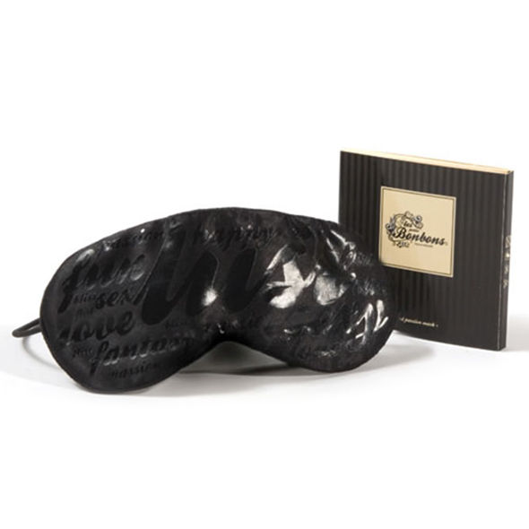 Antifaz negro Bijoux Petits Bonbons con acabado brillante y caja del producto.