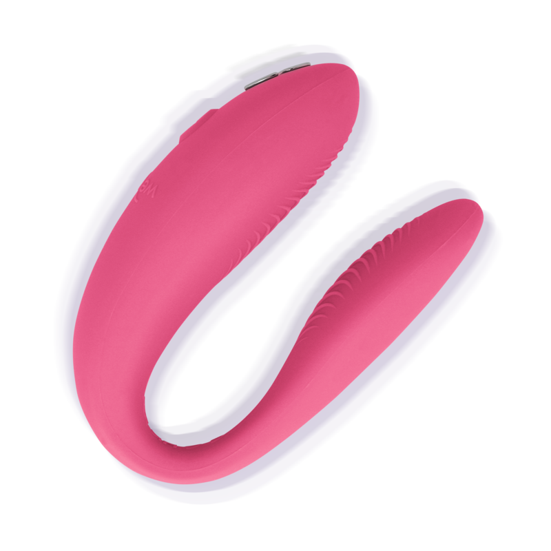 We-Vibe Sync Lite rosa en vista lateral, con diseño en C y botones superiores visibles.