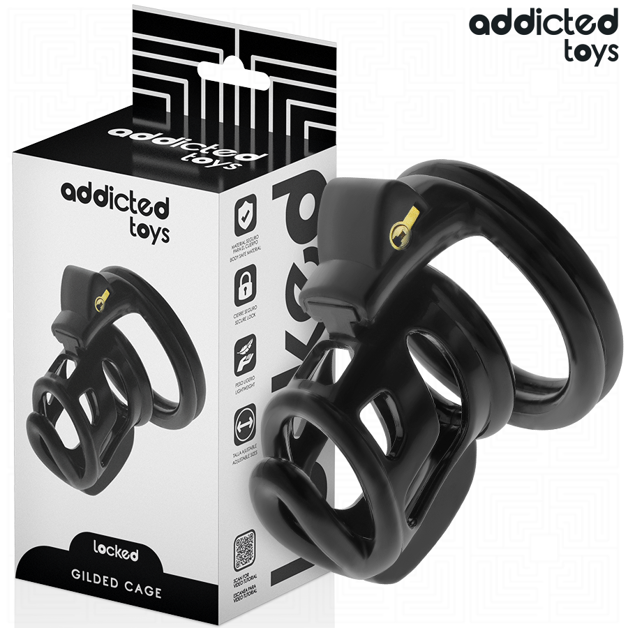 Jaula de pene Gilden Cage de Addicted Toys, en negro, junto a la caja del producto.