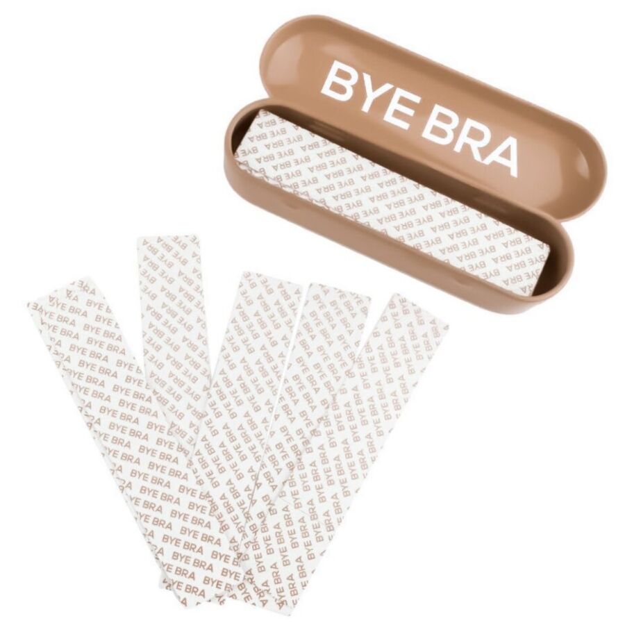 BYE BRA Dress Tape en caja metálica beige con varias tiras adhesivas visibles.