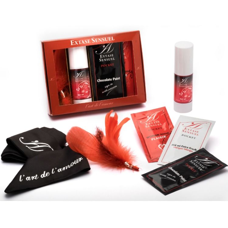 Cofre de viaje Extase Sensuel con caja roja, sobres y frasco pequeño.