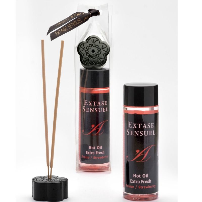 EXTASE SENSUEL Extra Fresh, aceite de masaje en envase negro y rosa con varillas difusoras al lado.