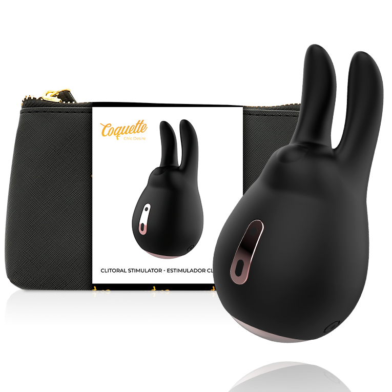 Estimulado de clítoris Coquette Chic Desire negro con detalle dorado y caja del producto.